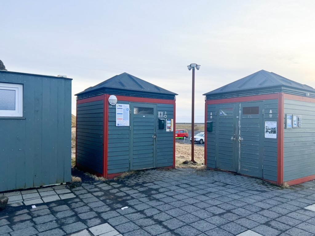 The exterior of the bathrooms that are free and heated in the parking lot of the falls