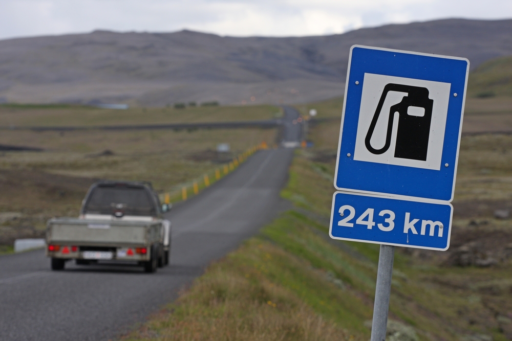 A sign for a gas station on a road in Iceland. 