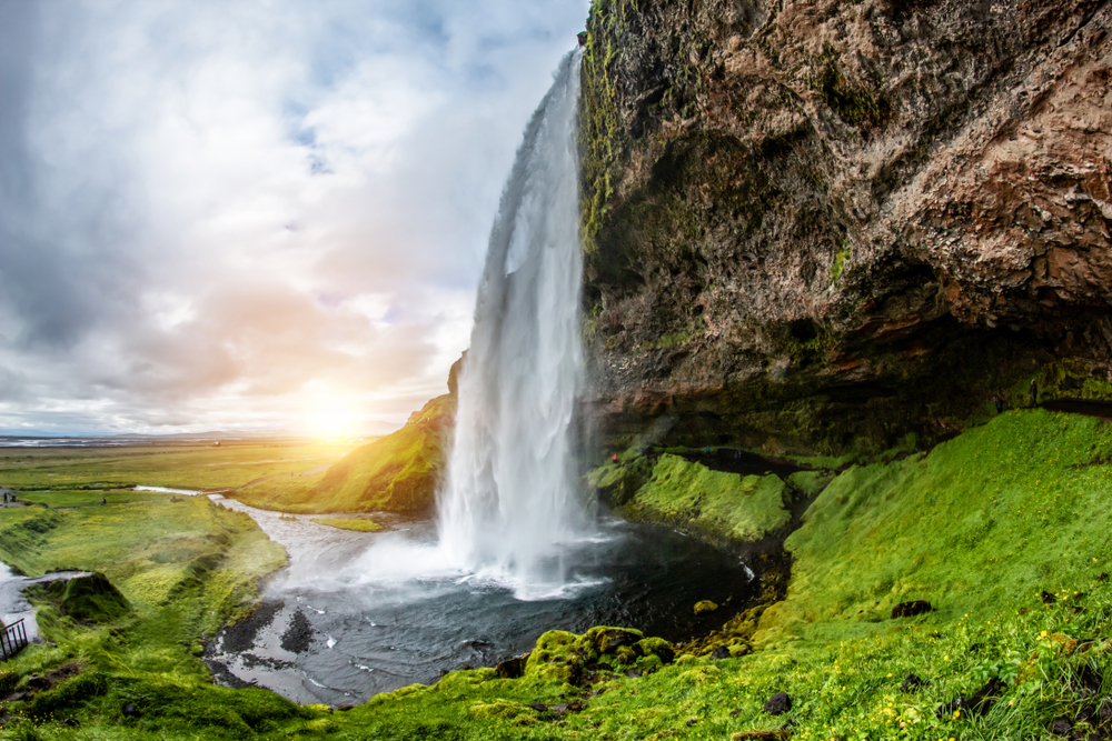 Seljalandsfoss waterall from the side with an increadibel view of the landscape behind. 