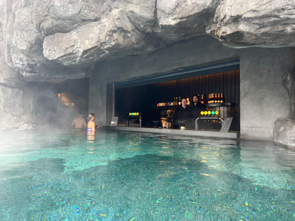 The swim up bar at the Sky lagoon featuring a concrete bar inside the lagoon