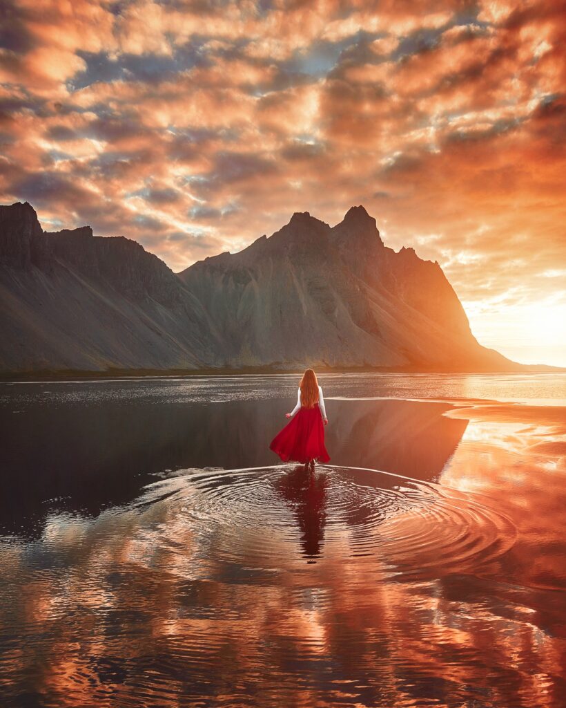 walking on the water at Stokksnes under the glow of the midnight sun in Iceland in June