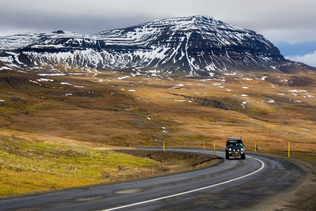 Car driving along Icelandic mountain road