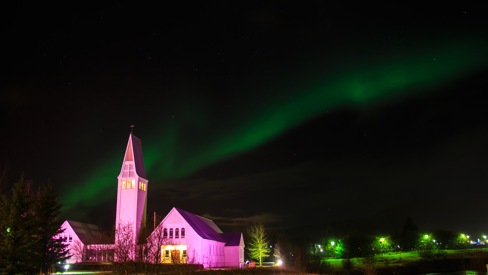 the Northern Lights over Selfosskirkja in the town of Selfoss