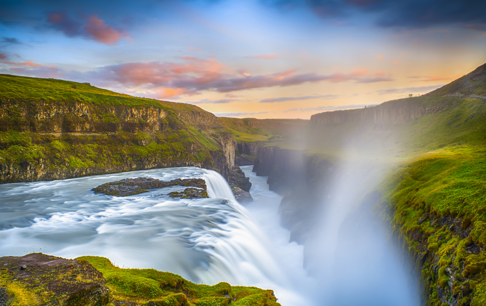 Gullfoss Falls, Iceland. The photo is takne on long exposure and there is grass and rocks around. 