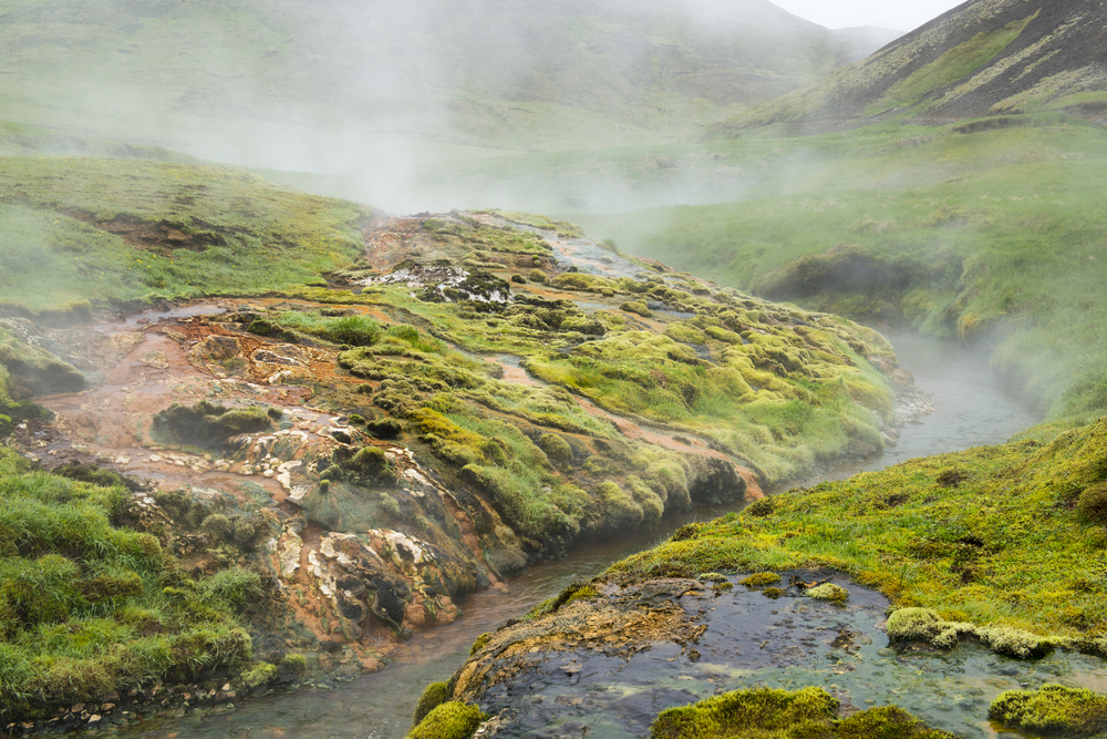 Geothermal valley of hot springs near Hveragerdi town, thermal river, Iceland.